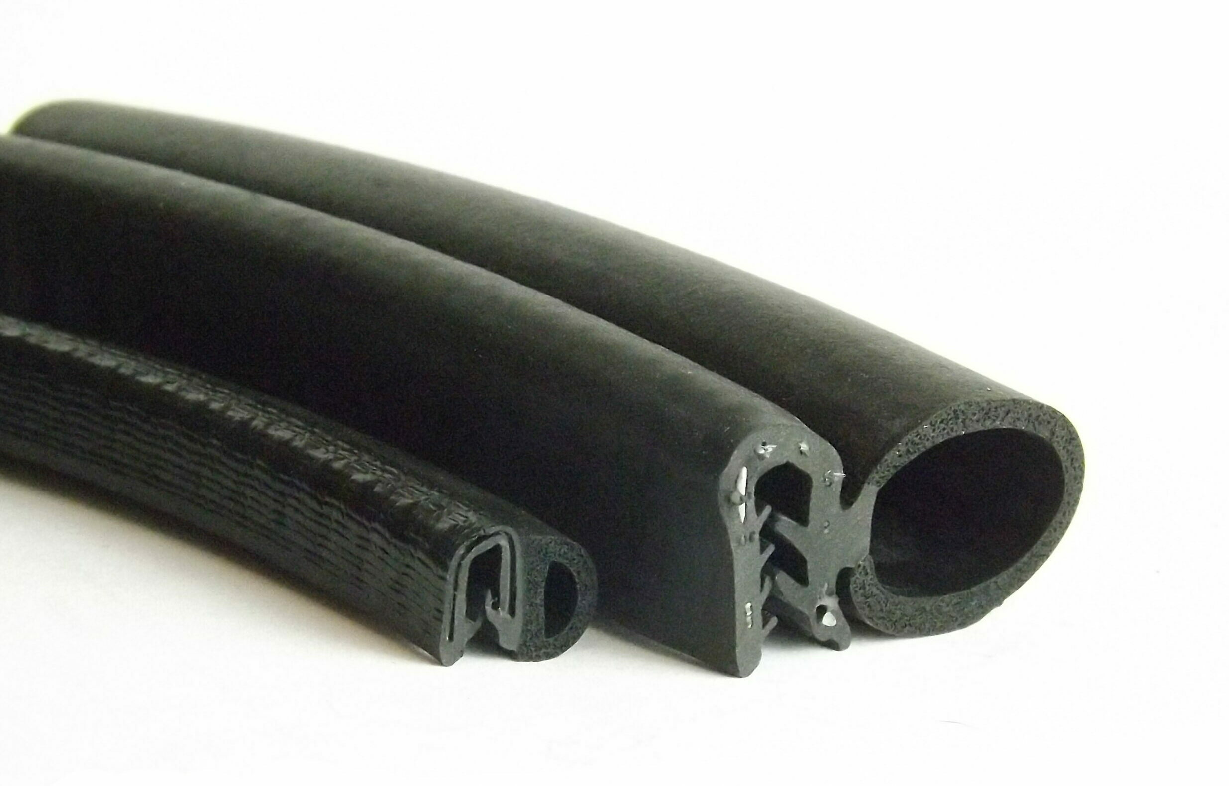 Automotive door seal showing steel-reinforced edge trim and sponge sealing bulb